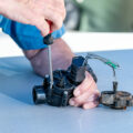 Grow With The Flow Irrigation repairing a sprinkler system
