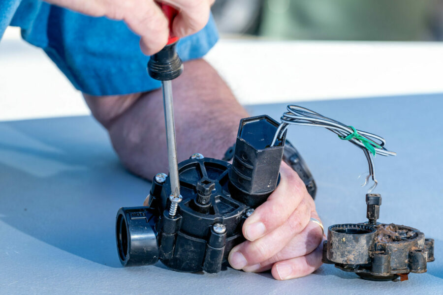 Grow With The Flow Irrigation repairing a sprinkler system